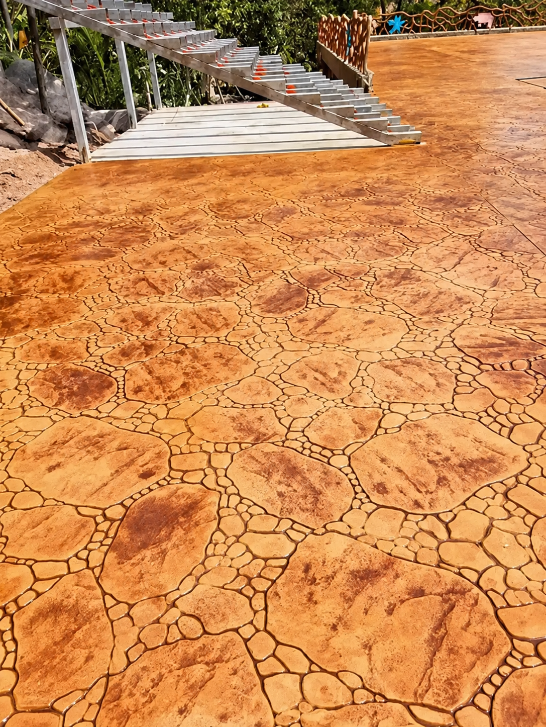The Hidden Geometry of Random Stone Stamped Concrete