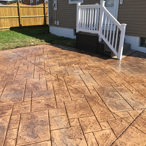 Rustic Stone Elegance: Transforming Concrete into Timeless Patios